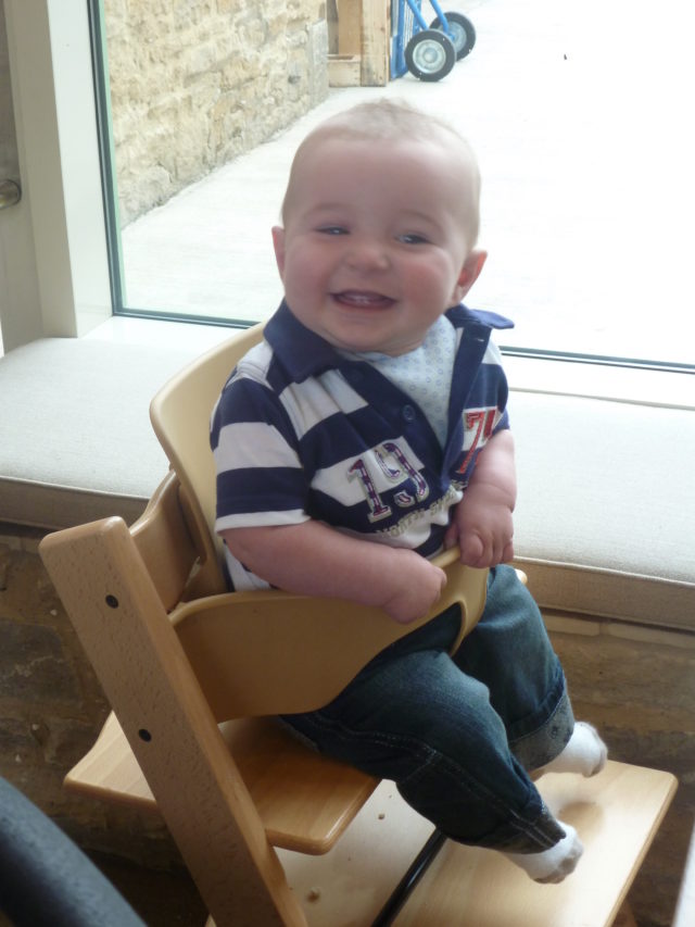 sitting in the highchair at Daylesford