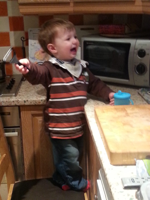 Toddler helping with cooking