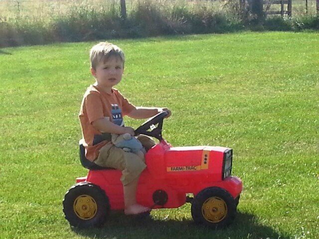chilling on a toy tractor