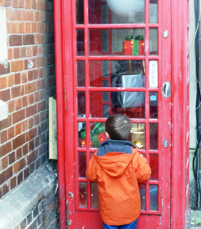 christmas present filled red phone box