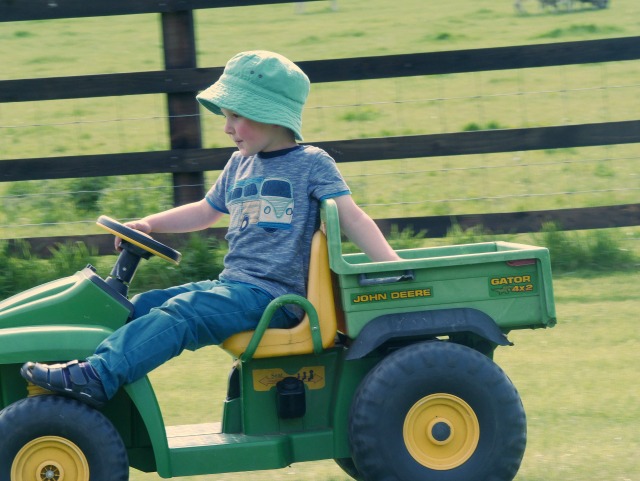 relaxed riding his John Deere Gator