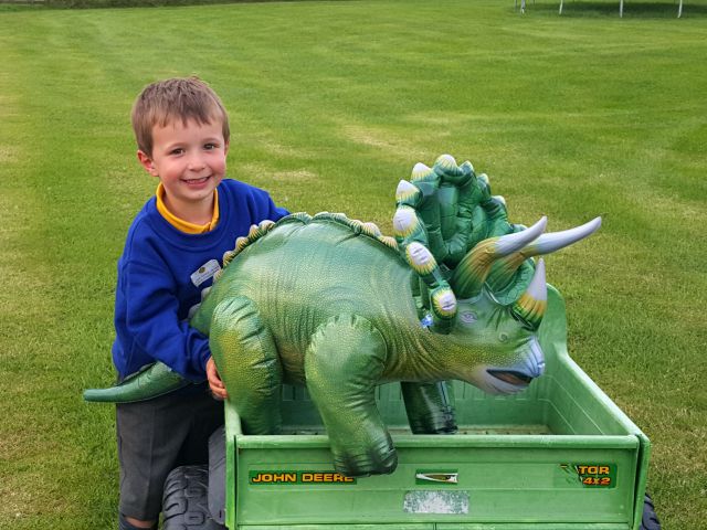 happy with the giant dinosaur