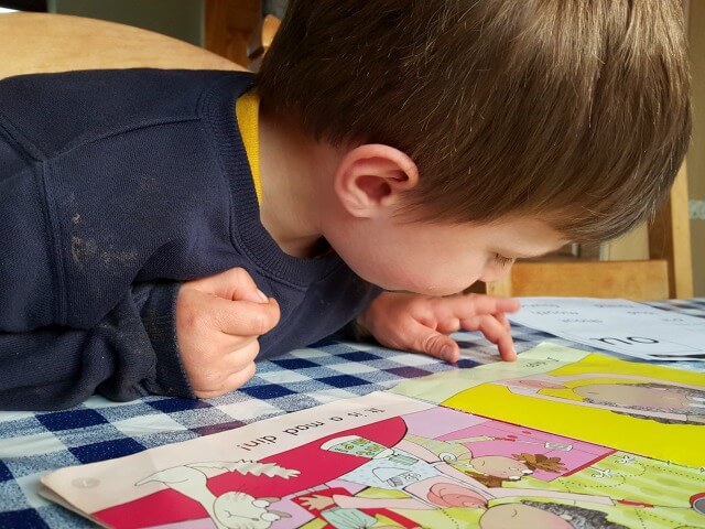 Reading his school book - Bubbablueandme