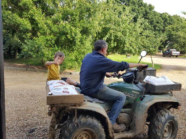 riding with his dad on the quad bike