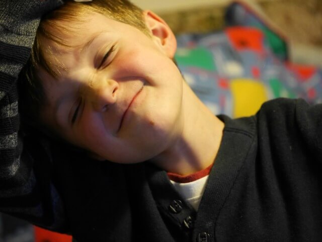 Grinning and ready to chat about school