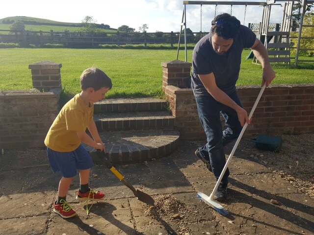 after school brushing and sweeping up outside
