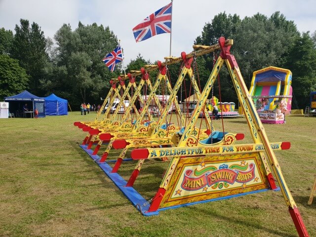 old fashioned swing boats at banbury show