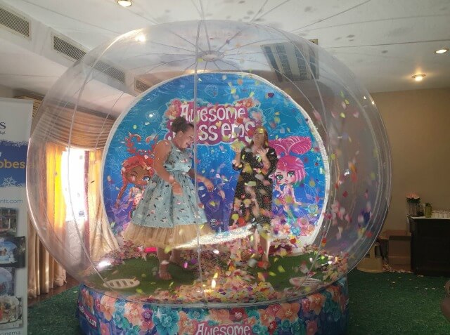 giant petals snowdome with people catching petals