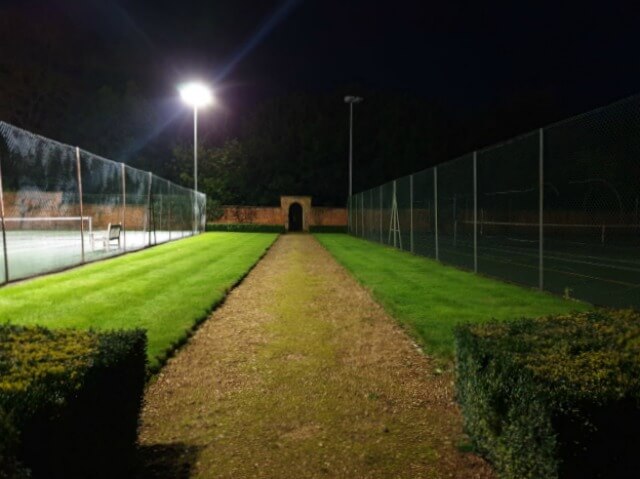 inbetween floodlit tennis courts