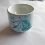 green nail polish marbling on white egg cup