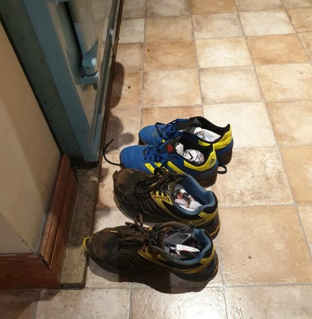 muddy trainers in front of the aga