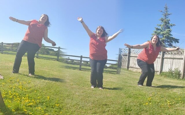 Many me 3 versions of woman posing in garden taken with Pivo