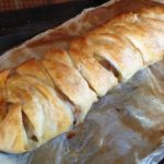 cooked sausage plait just out of the oven