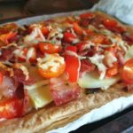 cooked super loaded potato bacon tomato and cheese tart
