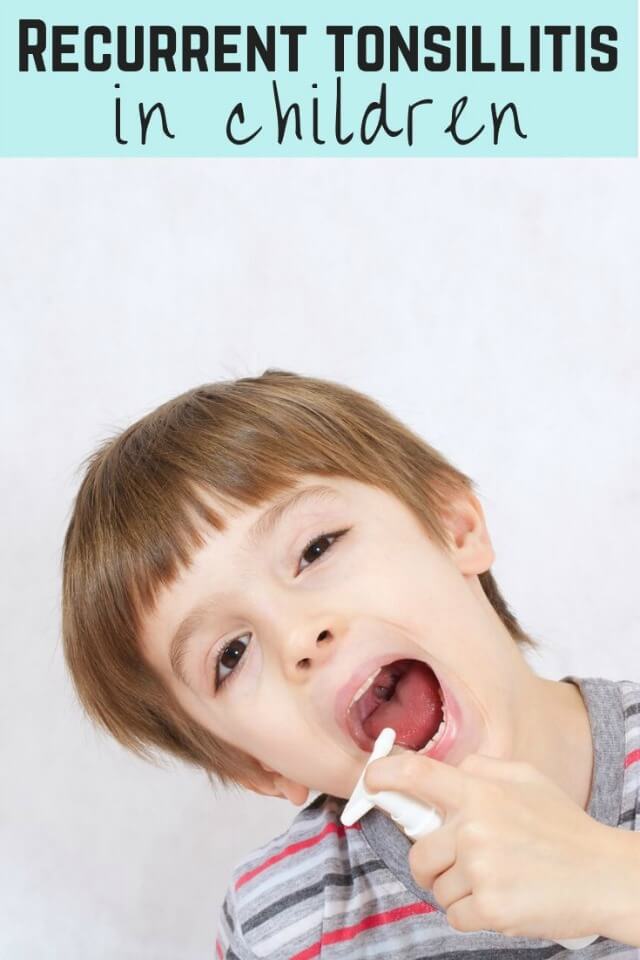 recurrent tonsillitis in children - boy with sore throat spray