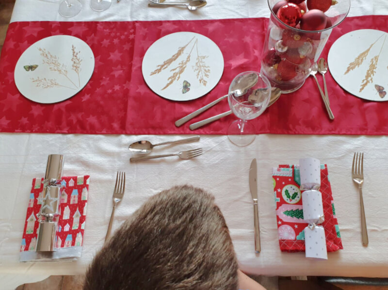 table set for christmas shot from above