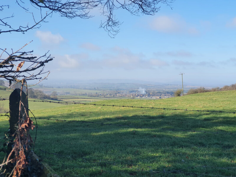 View from the top of the hill above Warwickshire looking down the valley to the village