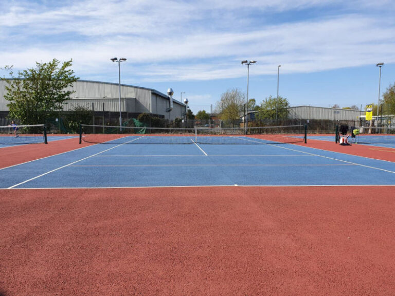 red and blue macadam tennis court from front view