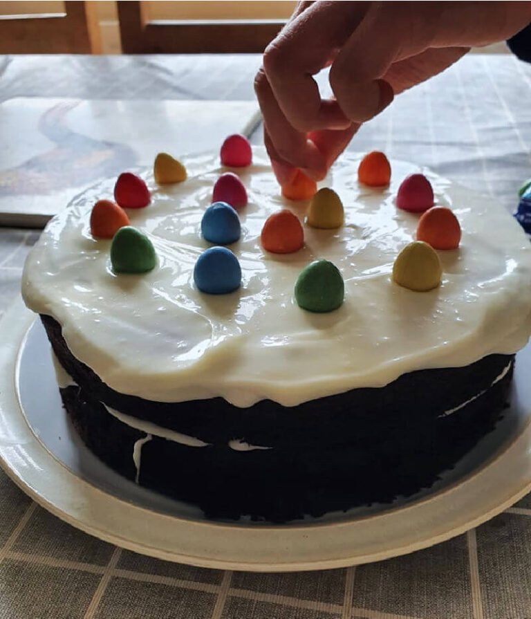 chocolate cake with icing and smarties eggs