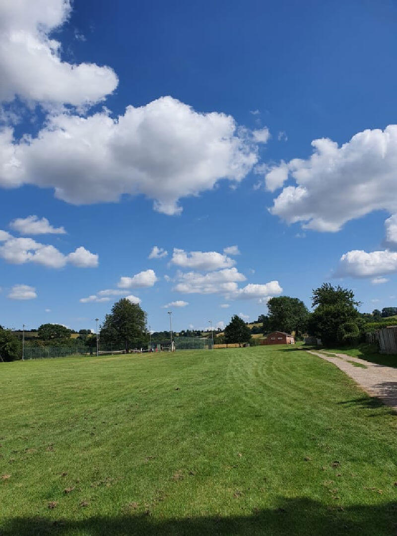 view over the park to a tennis court