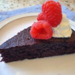 nigella's olive oil cake slice with cream and raspberries