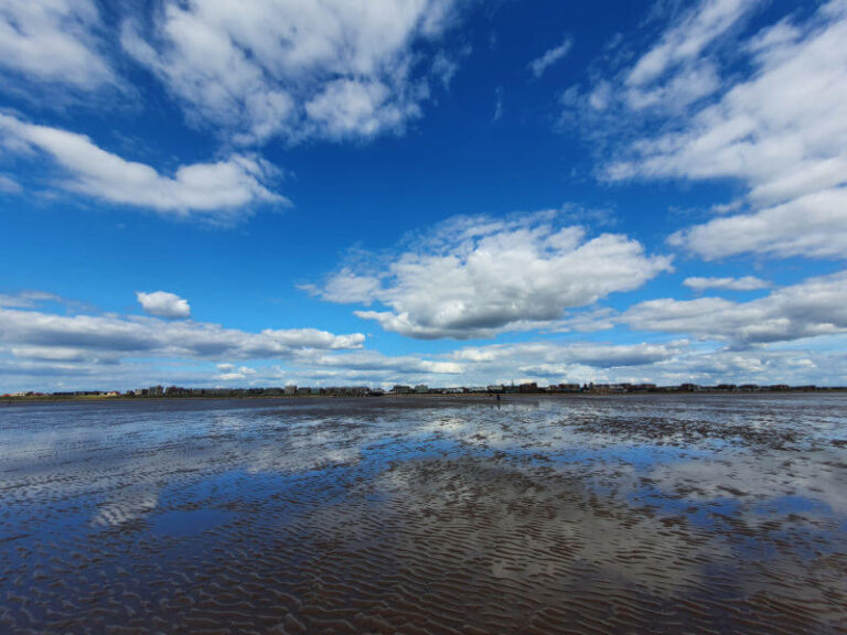 reflection of sky in the water covered beach at St Annes