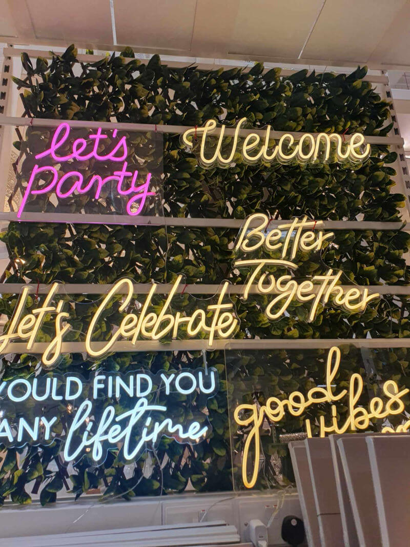 neon christmas signs on store display